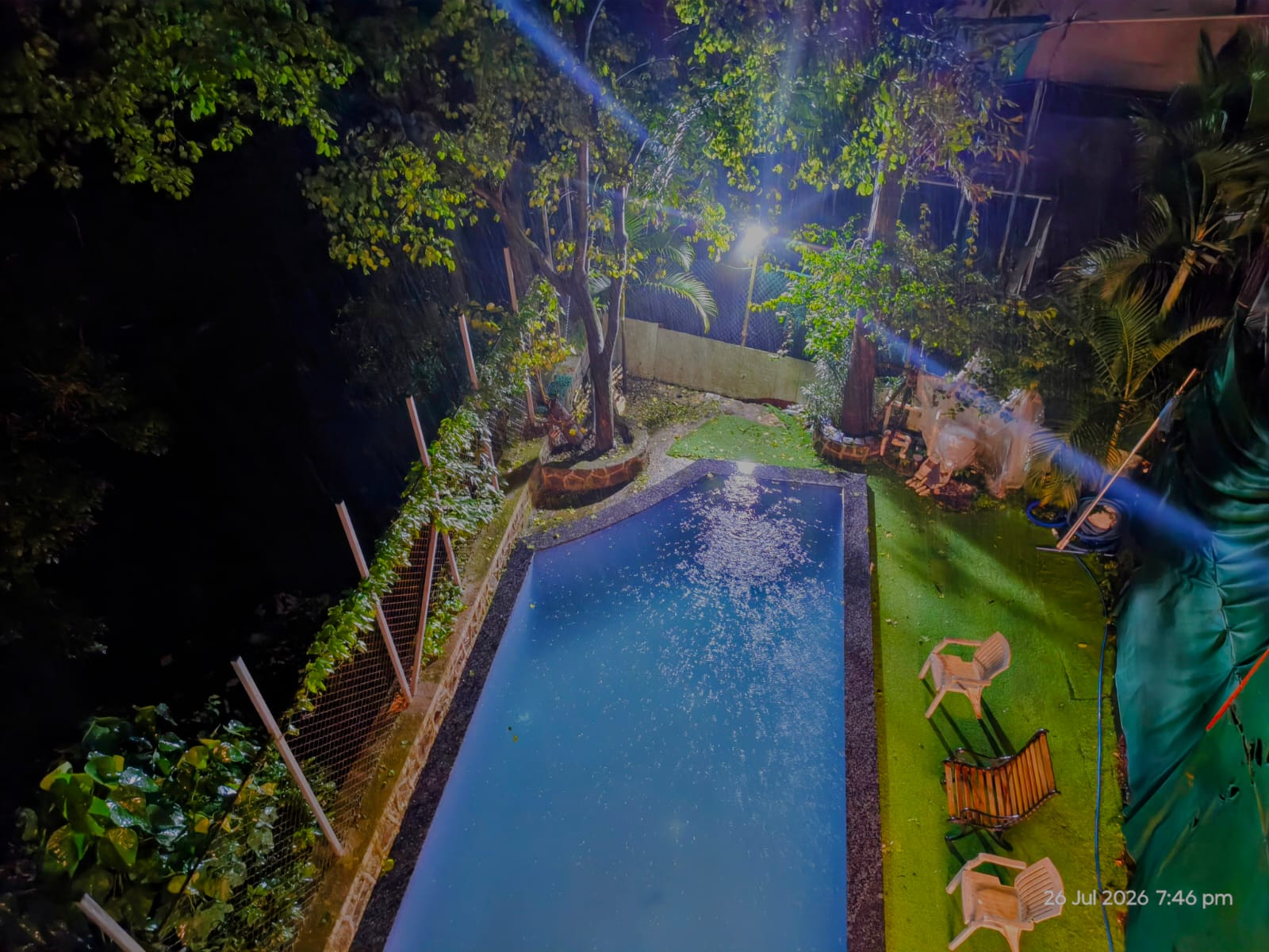 Private swimming pool at night at Cabin in the Woods, a 3.5 BHK villa in Tungarli, Lonavala